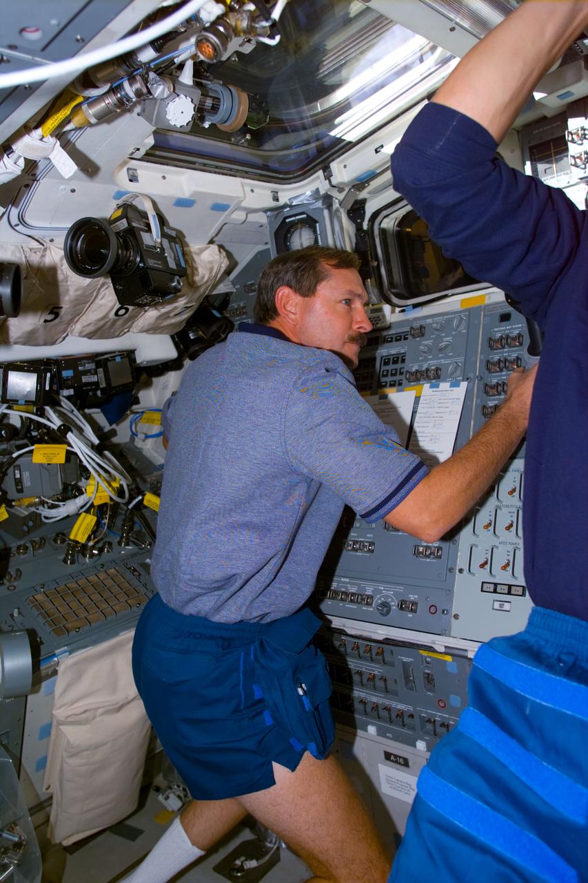 STS095-E-5134 (3 Nov. 1998) --- Astronaut Curtis L. Brown, STS-95 commander, on Discovery's aft flight deck during operations to retrieve the free-flying Spartan 201-05 satellite. The photograph was taken with an electronic still camera (ESC) at 3:17:38 GMT, Nov. 3.