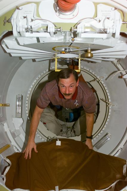 NASA image: Brown enters transfer tunnel