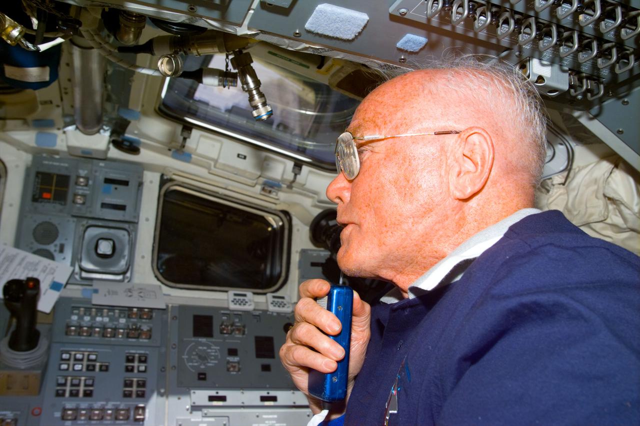STS095-E-5178 (31 Oct. 1998) --- U.S. Sen. John H. Glenn Jr., STS-95 payload specialist, talks to flight controllers in Houston from the flight deck of Discovery during Flight Day two activity. The photo was taken with an electronic still camera (ESC) at 00:48:48 GMT, Oct. 31.