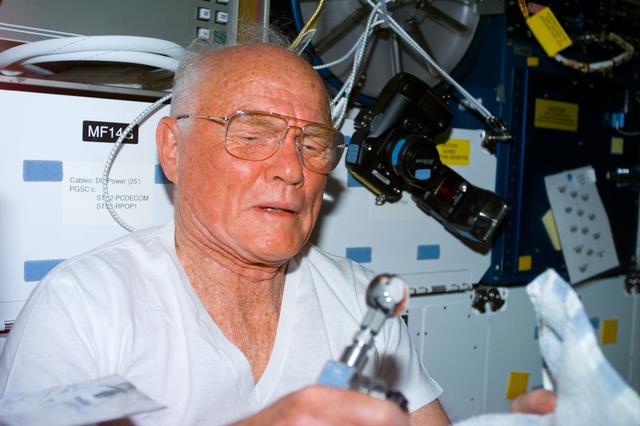 NASA image: Candid views of Glenn with water bubbles on middeck