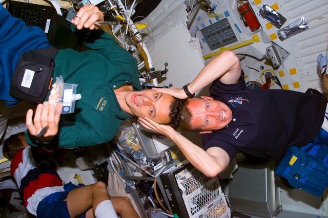 NASA image: Candid views of Lindsey and Duque on the middeck