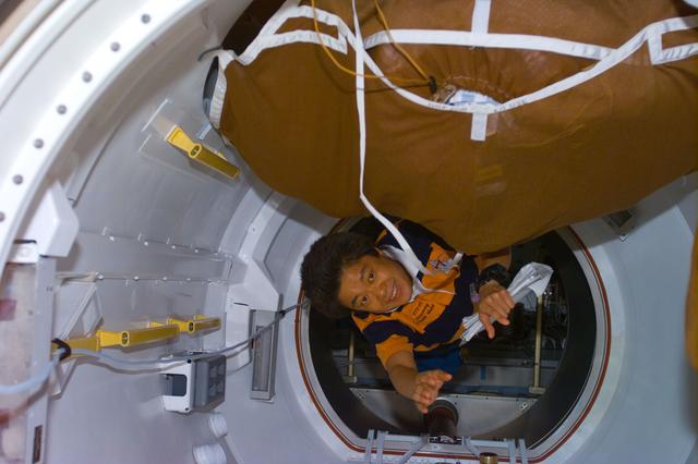 NASA image: Mukai prepares to fly down transfer tunnel