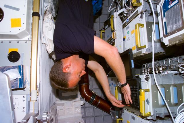 NASA image: Lindsey with lap top in the Spacehab