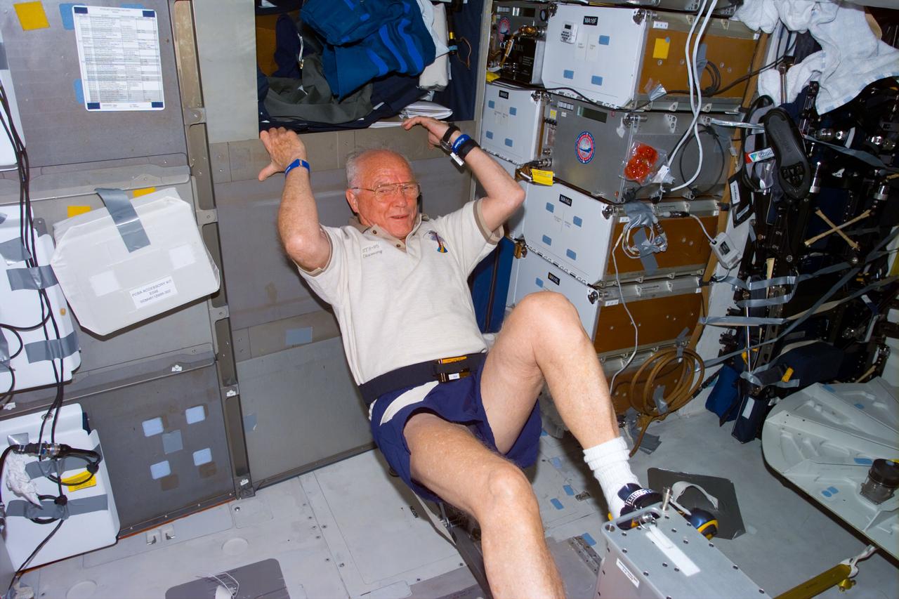 STS095-E-5251 (4 Nov. 1998) --- U.S. Sen. John H. Glenn Jr. (D.-Ohio), STS-95 payload specialist, works out on the ergometer device onboard Discovery. The photograph was taken with an electronic still camera  (ESC) at 21:52:07 GMT, Nov. 4.