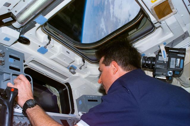 NASA image: Robinson at RMS controls on aft flight deck during Spartan 201 retrieval