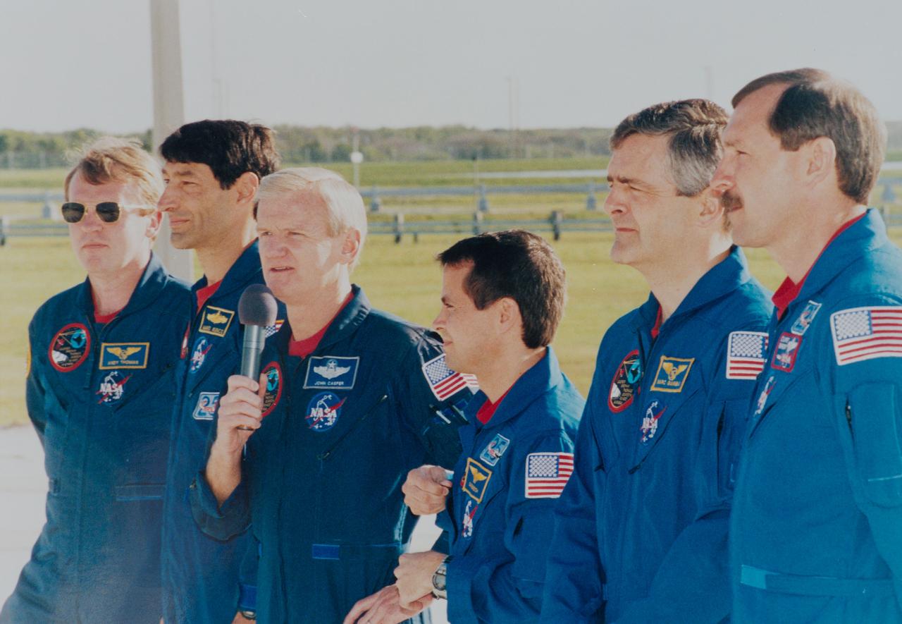 S96-08027 (22 April 1996) --- The crew talk to the news media at Launch Pad 39B, at the Kennedy Space Center (KSC).  From left are astronauts Andrew S. W. Thomas, mission specialist; Mario Runco, Jr., mission specialist; John H. Casper, commander; Daniel W. Bursch, mission specialist; Marc Garneau, mission specialist representing the Canadian Space Agency (CSA); and Curtis L. Brown, Jr., pilot.  The astronauts are at KSC for the Terminal Countdown Demonstration Test (TCDT), a dress rehearsal for launch, the Space Shuttle Endeavour is undergoing preparations at Pad 39B for liftoff on the fourth Shuttle flight of 1996 around May 16, 1996.