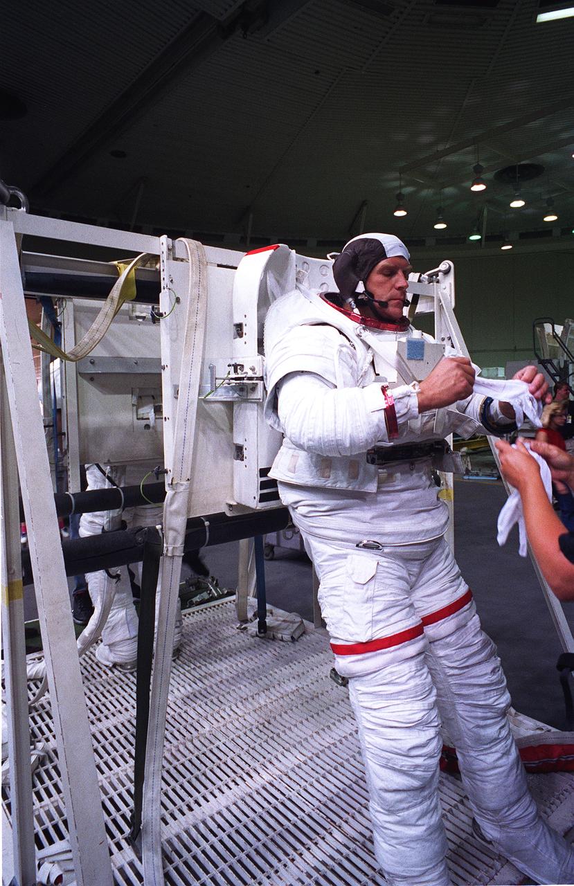 S96-11811 (10 June 1996) --- Astronaut Mark C. Lee, STS-82 payload commander training for extravehicular activity (EVA) involved with the servicing of the Hubble Space Telescope (HST), prepares to enter a water tank at the Johnson Space Center (JSC).  Moments later, Lee was neutrally buoyant, rehearsing some of the HST servicing chores with a crewmate.