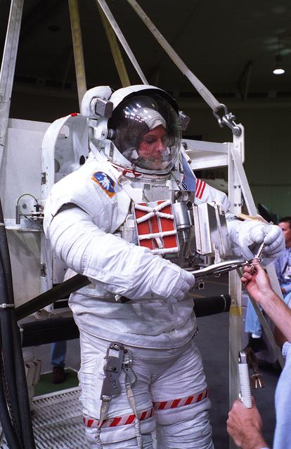 NASA image: Astronauts Greg Harbaugh and Joe Tanner suit up for training in WETF