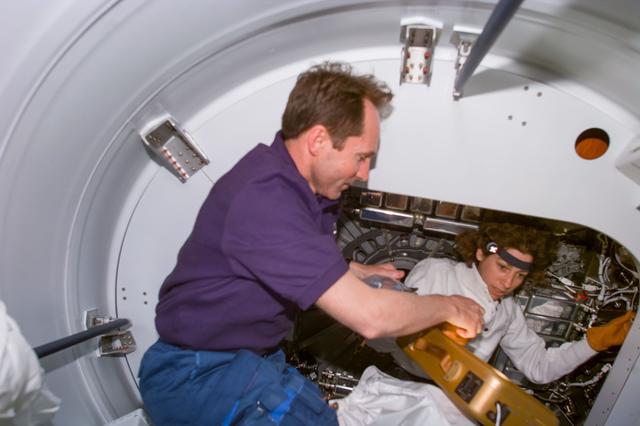 NASA image: Ellen Ochoa  and Valeri Tokarev prepare for Node 1/Unity ingress