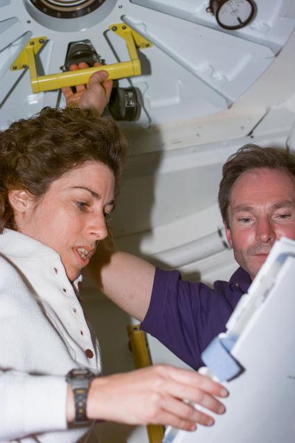 NASA image: Ellen Ochoa and Valeri Tokarev prepare to open hatch from PMA2 into Node 1