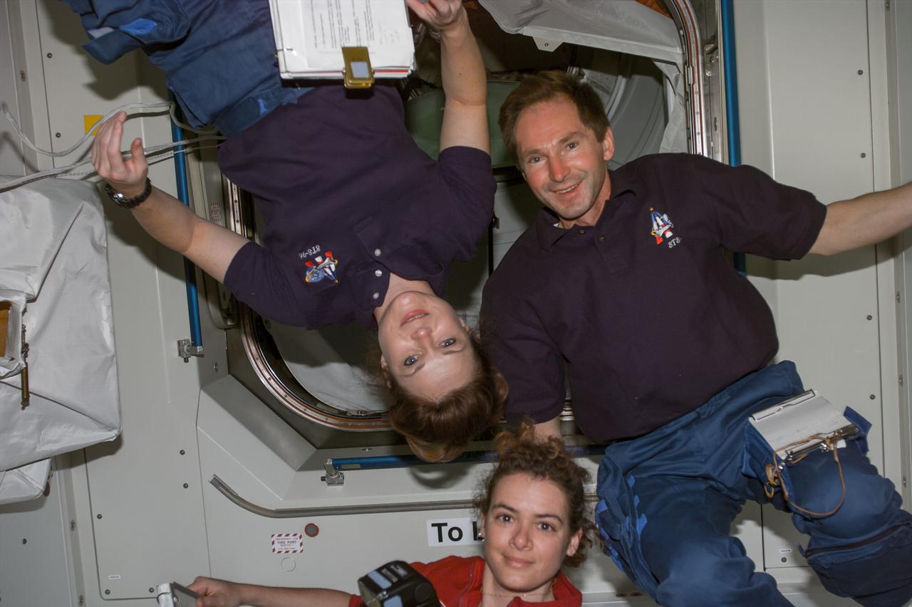 S96-E-5078 (31 May 1999) --- Flight Day 5 activity called for some of Discovery's crew members to work in the Unity node, part of the International Space Station (ISS).  From the left are astronauts Tamara Jernigan and Julie Payette, along with cosmonaut Valery I.   Tokarev.  Payette represents the Canadian Space Agency (CSA) and Tokarev is  with the Russian Space Agency (RSA). The photo was taken at 01:50:38, May 31, 1999.