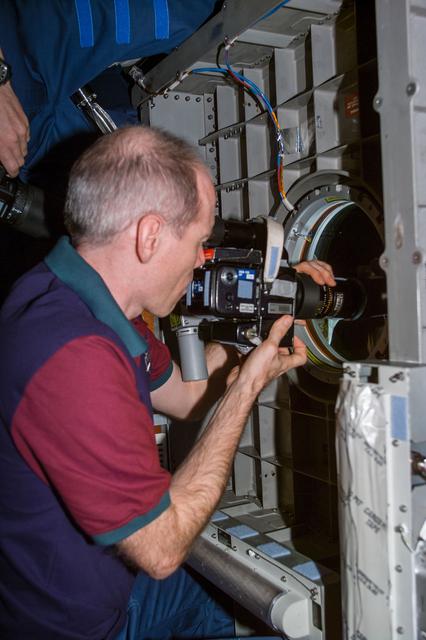NASA image: Daniel Barry in Spacehab module with camera