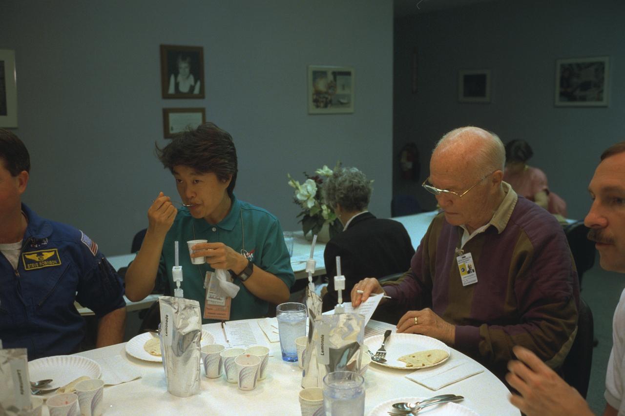 S98-08730 (9 April 1998) --- Four members of the STS-95 crew participate in a food tasting session at the Johnson Space Center (JSC). From the left are Stephen K. Robinson, mission specialist; payload specialist Chiaki Mukai of Japan's National Space Development Agency (NASDA); U.S. Sen. John H. Glenn Jr., payload specialist; and Curtis L. Brown Jr., mission commander. They will be joined by three other astronauts when Discovery lifts off in late October of this year for a scheduled nine-day mission.  The photo was taken by Joe McNally, National Geographic, for NASA.