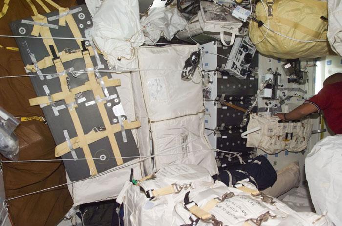 STS98-E-5010 (8 February 2001) --- This mid deck scene on the Earth-orbiting Space Shuttle Atlantis resembles the interior of a moving van, with equipment and supplies temporarily stored there.  The STS-98 crew will transfer much of the gear over to the International Space Station (ISS) once the shuttle and station are docked later in the week. The scene was recorded with a digital still camera.