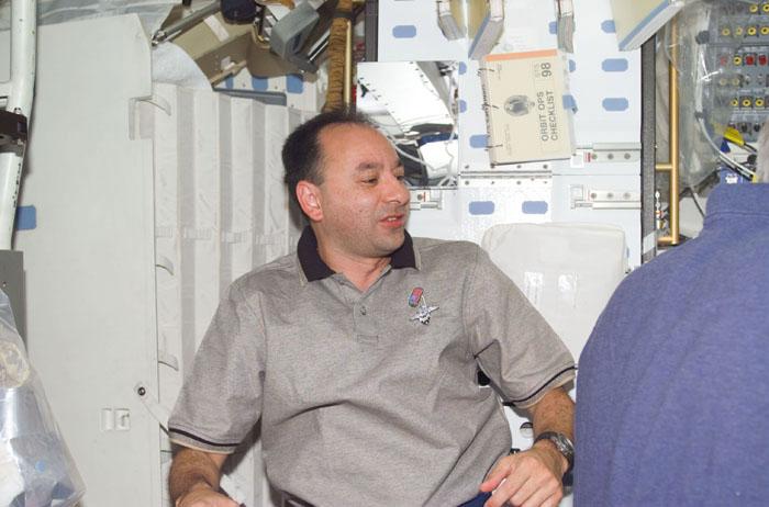 STS98-E-5016 (9 February 2001) ---  Astronaut Mark L. Polansky, pilot for STS-98, is pictured on the mid deck of the Earth-orbiting Space Shuttle Atlantis prior to the start of a busy Flight Day 2 itinerary.  The scene was recorded with a digital still camera.