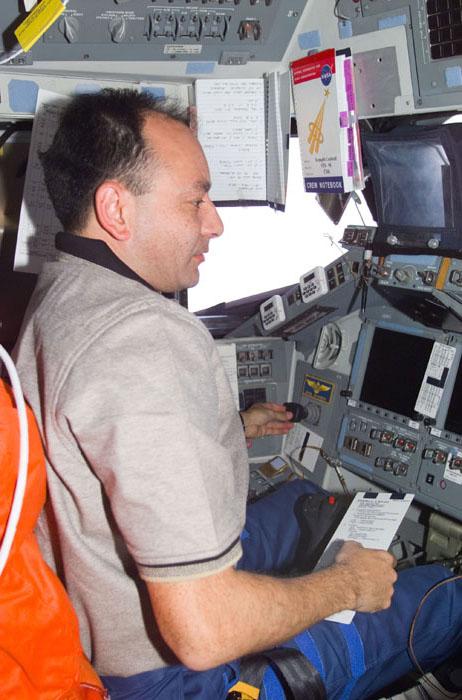 STS98-E-5024 (9 February 2001) --- Astronaut Mark L. Polansky, pilot, temporarily mans the commander's station on the flight deck of the Space Shuttle Atlantis during STS-98 Flight Day 2 maneuvers. The photograph was recorded with a digital still camera.