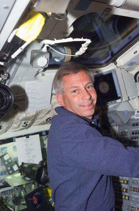 STS98-E-5036 (9 February 2001) --- Astronaut Kenneth D. Cockrell, mission commander,  is pictured at Atlantis' aft flight deck console during rendezvous operations between the Space Shuttle Atlantis and the International Space Station (ISS).  Atlantis went on to dock with the station on schedule at 10:51 a.m. (CST), Feb. 9.  A digital still camera was used to record the scene.