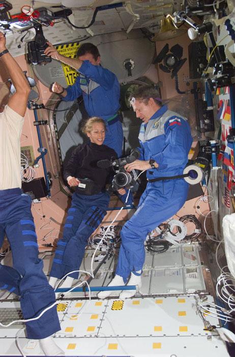 STS98-E-5049 (9 February 2001) ---  Astronaut Marsha S. Ivins, STS-98 mission specialist, discusses camera gear with astronaut William M. (Bill) Shepherd, Expedition One mission commander, soon after the shuttle and station crews reunited onboard the outpost.  This scene was recorded with a digital still camera.