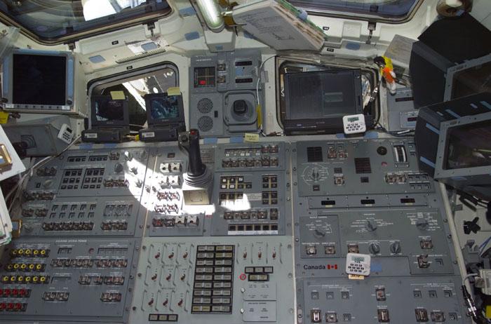 STS98-E-5082 (10 February 2001) --- A medium close-up view shows the control console on the aft flight deck of the Space Shuttle Atlantis during Flight Day 4 activity. Located here are shuttle operational controls, as well as the device for maneuvering the Remote Manipulator System (RMS) arm. The scene was recorded with a digital still camera.