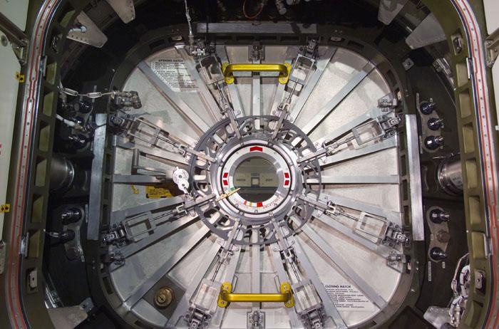 STS98-E-5114 (11 February 2001) --- This medium close-up shot, photographed with a digital still camera, shows Unity's closed hatch to the newly delivered Destiny laboratory.  The crews of Atlantis and the International Space Station opened the laboratory, shortly after this photo was made on Feb. 11, and the astronauts and cosmonauts spent the first full day of what are planned to be years of work ahead inside the orbiting science and command center. Station commander William M. (Bill) Shepherd opened the Destiny hatch, and he and shuttle commander Kenneth D. Cockrell ventured inside at 8:38 a.m. (CST), Feb. 11.  As depicted in subsequent digital images in this series, members of both crews went to work quickly inside the new module, activating air systems, fire extinguishers, alarm systems, computers and internal communications. The crew also continued equipment transfers from the shuttle to the station.
