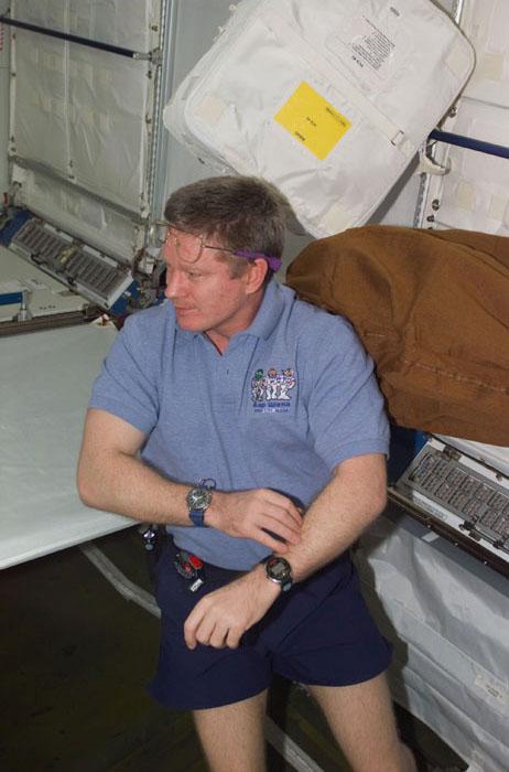 STS98-E-5160 (11 February 2001) --- Astronaut William M. (Bill) Shepherd,  Expedition One commander, surveys the interior of the newly attached Destiny laboratory onboard the International Space Station (ISS).  After the Destiny hatch was opened early in the day, members of both crews went to work quickly inside the new module, activating air systems, fire extinguishers, alarm systems, computers and internal communications. The crews also took some photos and continued equipment transfers from the shuttle to the station. The scene was taken with a digital still camera.