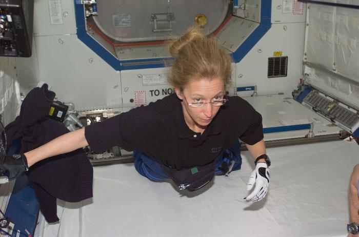 STS98-E-5161 (11 February 2001) --- Astronaut Marsha S. Ivins, STS-98 mission specialist, floats into the newly attached Destiny laboratory onboard the International Space Station (ISS).  After the Destiny hatch was opened early in the day, members of both crews went to work quickly inside the new module, activating air systems, fire extinguishers, alarm systems, computers and internal communications. The crews also took some photos and continued equipment transfers from the shuttle to the station. The scene was taken with a digital still camera.