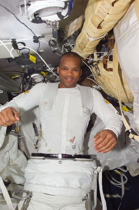 STS98-E-5170 (12 February 2001) --- Astronaut Robert L. Curbeam, STS-98 mission specialist, dons his extravehicular mobility unit for the upcoming space walk on the International Space Station on February 12.  This scene was recorded with a digital still camera.
