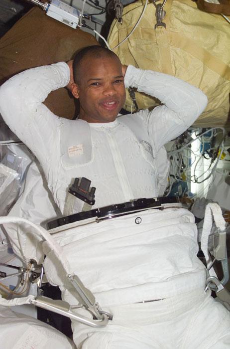 STS98-E-5177 (12 February 2001) --- Astronaut Robert L. Curbeam, STS-98 mission specialist, dons his extravehicular mobility unit for the upcoming space walk on the International Space Station on February 12.  This scene was recorded with a digital still camera.