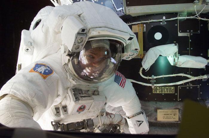 STS98-E-5193 (12 February 2001) --- Astronaut Robert L. Curbeam, STS-98 mission specialist, is pictured near Pressurized Mating Adapter (PMA-3) during the second of three scheduled space walks on 5a. The scene was recorded with a digital still camera.