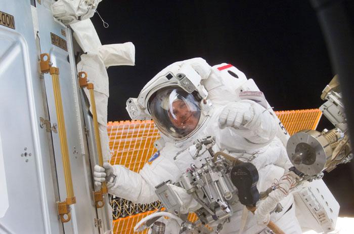 STS98-E-5194 (12 February 2001)--- Astronaut Thomas D. Jones, STS-98 mission specialist, grabs a hand rail while working on the International Space Station (ISS) during the second of three scheduled space walks involving himself and astronaut Robert L. Curbeam and assisted by their STS-98 crew mates aboard the Atlantis.  The scene was recorded with a digital still camera.