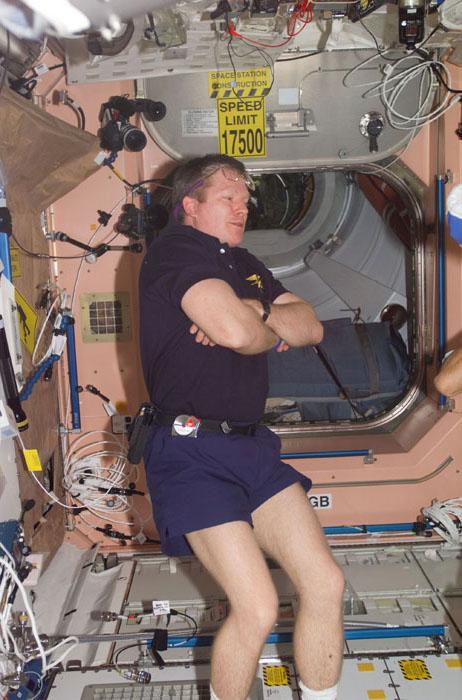 STS98-E-5287 (16 February 2001) ---  Astronaut William M. (Bill) Shepherd, Expedition One commander, participates in a parting chat with some astronaut visitors (out of frame), about to conclude their time on the outpost.   The scene was recorded with a digital still camera during farewells in the Unity node.