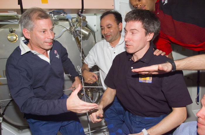 STS98-E-5295 (16 February 2001) ---  Astronaut Kenneth D. Cockrell (left),  STS-98 mission commander, participates in farewells with Expedition One crew members.  Cosmonaut Sergei K. Krikalev (right foreground), Expedition One flight engineer, is one of three crew members who will stay behind for several weeks prior to return to Earth. Astronauts Mark L. Polansky, STS-98 pilot, and Robert L. Curbeam, mission specialist, are also pictured.   The scene was recorded with a digital still camera.