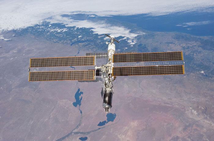 STS98-E-5312 (16 February 2001) --- The International Space Station (ISS) backdropped against Rio Negro, Argentina, following undocking. The photo was taken with a digital still camera.