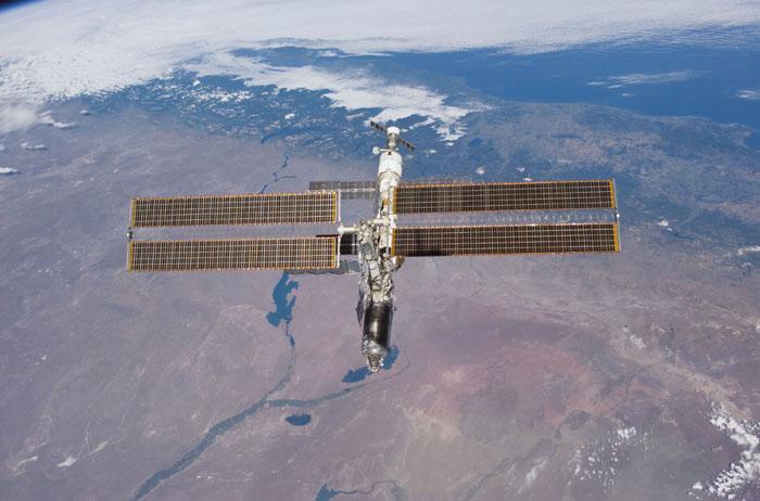 STS98-E-5313 (16 February 2001) --- The International Space Station (ISS) backdropped against the Rio Negro, Argentina following undocking. The photo was taken with a digital still camera.