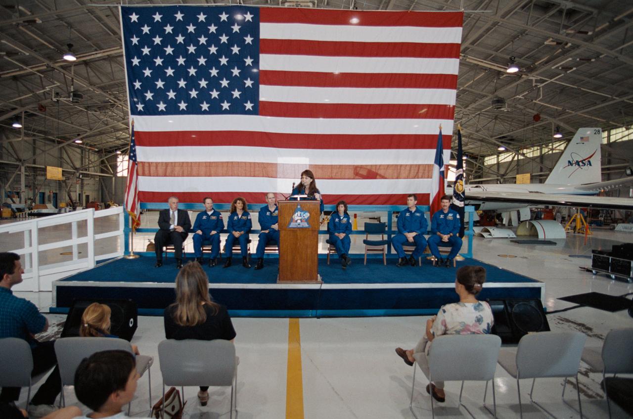 S99-05975 (7 June 1999) --- Astronaut Tamara E. Jernigan takes her turn at the lectern in Ellington Field's Hangar 990.  Her six crew mates and JSC Director George W.S. Abbey, all seated behind,  also spoke to the crowd gathered for the  welcome home ceremonies.