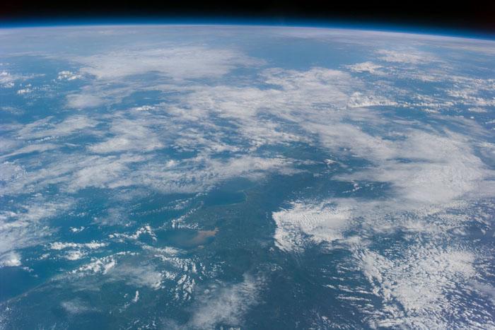 S99-E-5555 (17 February 2000) --- As photographed from the Space Shuttle Endeavour, this oblique electronic still image of Earth's horizon reveals a great deal of cloud cover.  In the case of the electronic still camera (ESC), as well as film-bearing instruments, clouds naturally obscure views of recognizable land masses. Much of Earth is heavily cloud covered during the current mission and meteorlogists and oceanographers are interested in studying that aspect. However, the Shuttle Radar Topography Mission's other sensing equipment, X-SAR and C-band antennae, are able to penetrate cloud cover and record important topographic data for mapmakers  and scientists of other disciplines.     In addition to the sensing equipment  mentioned above, this mission is supporting the EarthKAM project which   utilizes the services of another electronic still camera mounted in Endeavour's windows.  Unlike this oblique view, EarthKAM records strictly vertical or nadir imagery of points all over the world. Students across the United States and in France, Germany and Japan are taking photos throughout the STS-99 mission. And they are using these new photos, plus all the images  already available in the EarthKAM system, to enhance their classroom  learning in Earth and space science, social studies, geography, mathematics and more.