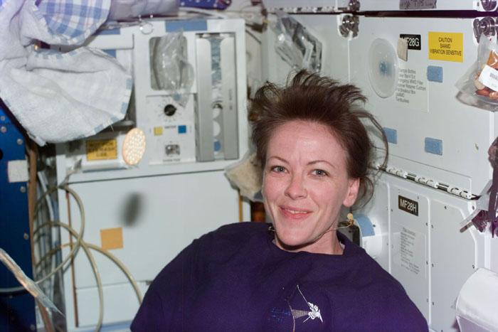 S99-E-5716 (18 February 2000) --- Astronaut Janet L. Kavandi on the mid deck of the Space Shuttle Endeavour. A series of electronic stills was taken of the STS-99 individual crew members on the day they got the good news from flight controllers in Houston that Shuttle Radar Topography Mission (SRTM) mapping time had been extended.