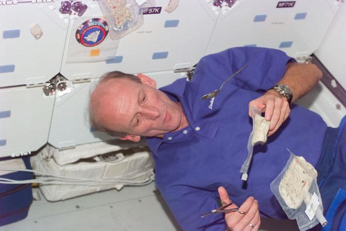 S99-E-5734 (18 February 2000) --- Astronaut Gerhard P.J. Thiele, mission specialist representing the European Space Agency, takes a meal break from Red Team Shuttle Radar Topography Mission (SRTM) duties onboard the Space Shuttle Endeavour.