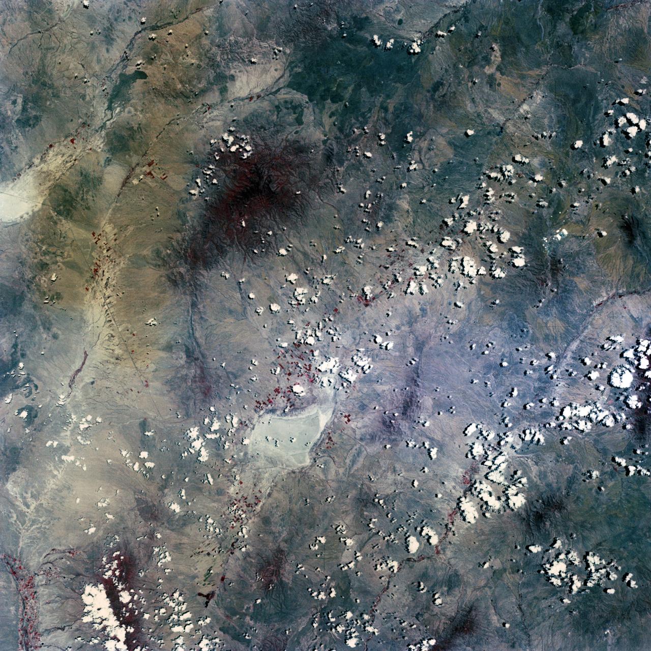 Scientist-Astronaut Joseph P. Kerwin, Skylab 2 science pilot, is photographed strapped into the sleep restraint in the crew quarters of the Orbital Workshop of the Skylab 1 and 2 space station cluster in Earth orbit. Kerwin is wearing the special cap which contains biomedical instrumentation for the M133 Sleep Monitoring Experiment. The purpose of the M133 experiment is to evaluate quantity and quality of sleep during prolonged space flight by the analysis of electroencephalographic (EEG) and electrooculographic (EOG) activity.