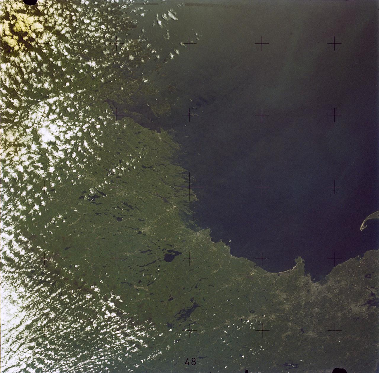 SL2-05-381 (22 June 1973) --- Boston, MA and the New England Coastline (43.5N, 84.0W) can be seen in this view. The typical rugged rocky coast of Maine is the result of heavy glacial action producing the rocky cliffs, jagged spurs of land and islands that characterize Main's Atlantic Coast. During the last Ice Age, extensive sediments were laid down producing a landscape of rolling hills with rocky outcrops. Photo credit: NASA