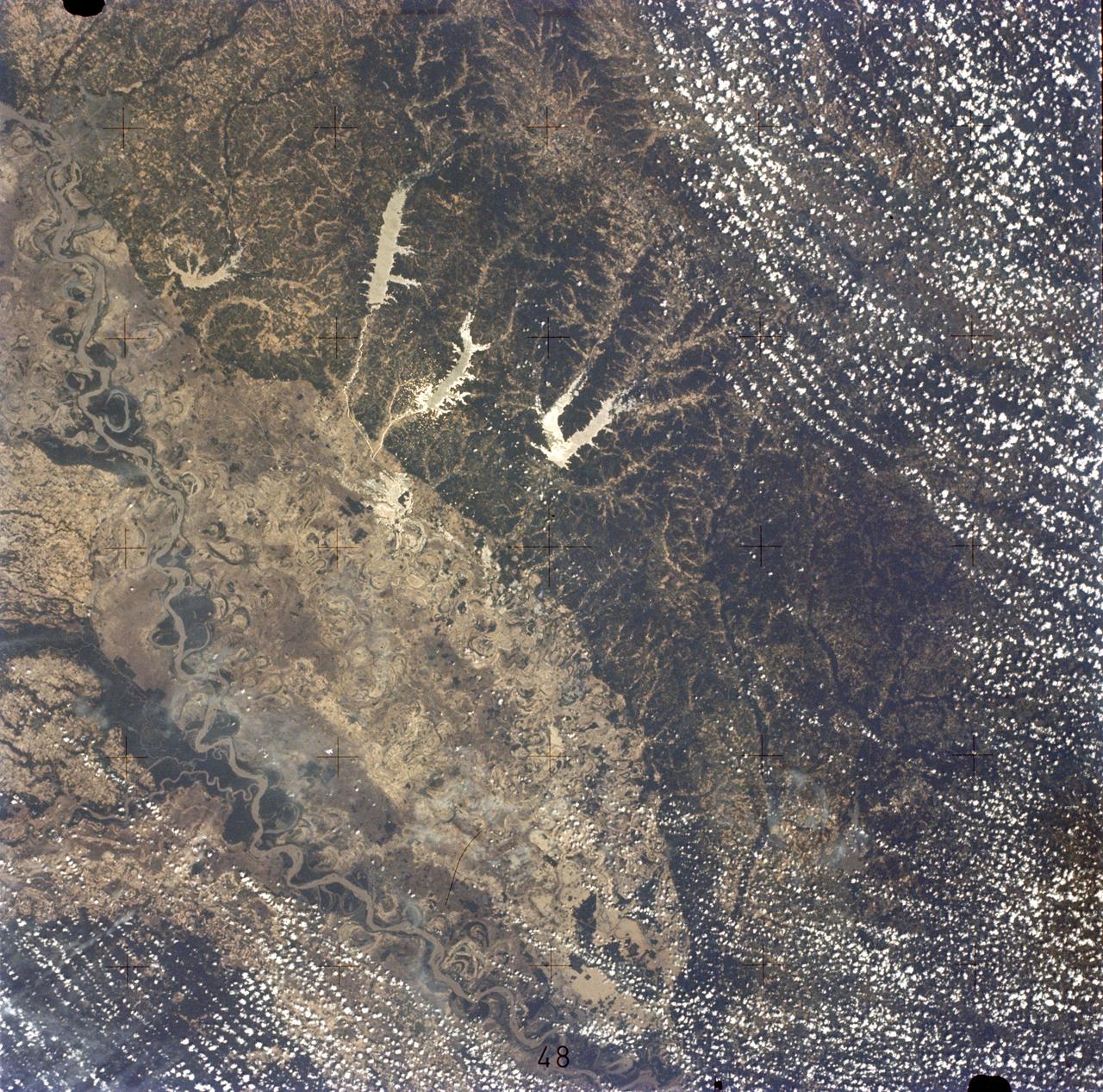 SL2-05-422 (22 June 1973) --- This section of the lower Mississippi River (34.0N, 90.0W) known as the Yazoo Basin, is characterized by a wide expanse of rich river bottomland with many oxbow lakes, the remains of the many changes in the riverbed over the course of many thousands of years. This soil is very fertile and productive but the region is prone to flooding. In this view, some of the back areas around the Delta National Forest show the effects of heavy spring rains. Photo credit: NASA