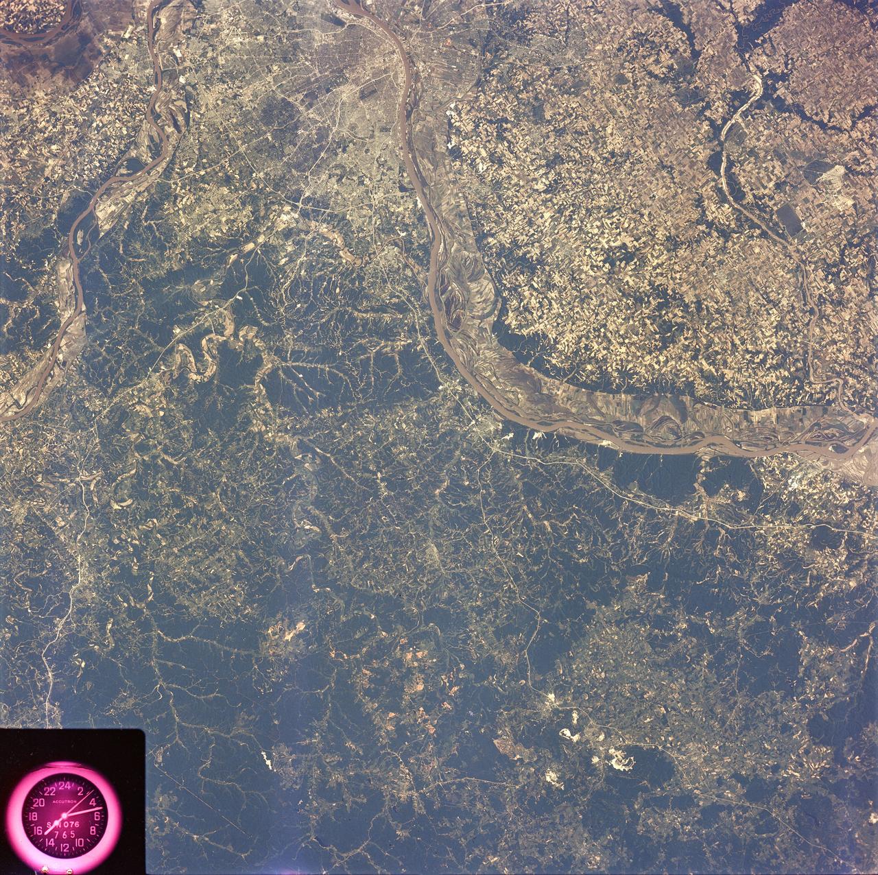 SL2-81-189 (22 June 1973) --- The well defined meanderings of the Mississippi River, just to the south of St. Louis, MO (38.5N, 90.5W) can easily be seen as curved lines and loops roughly paralleling the present river in this view showing the former water channels. The vegetated bluffs on either side of the river define the limits of the meanders where the rich river flood plain offers some of the most fertile land for agriculture although flooding remains a constant threat. Photo credit: NASA