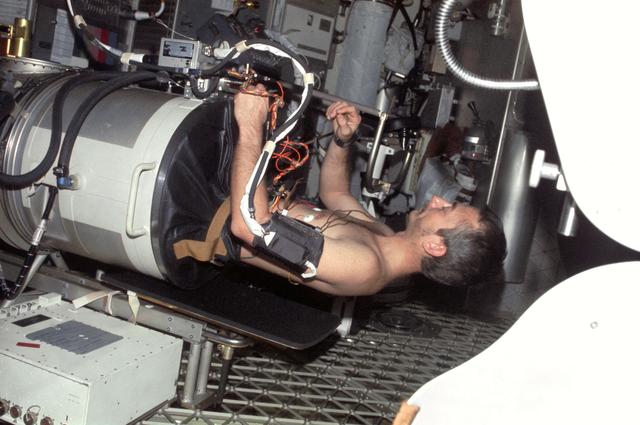 NASA image: Astronaut Owen Garriott lies in Lower Body Negative Pressure Device