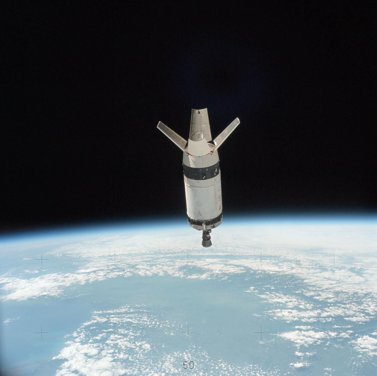 SL3-114-1625 (July-September 1973) --- An excellent view of the expended S-IVB second stage of the Skylab 3/Saturn 1B space vehicle is seen in this photograph taken from the Skylab 3 Command and Service Module (CSM) in Earth orbit. The land mass below is Italy and France, with part of the Mediterranean Sea visible. This photograph was taken with a handheld 70mm Hasselblad camera using a 100mm lens, and medium speed Ektachrome film. Photo credit: NASA