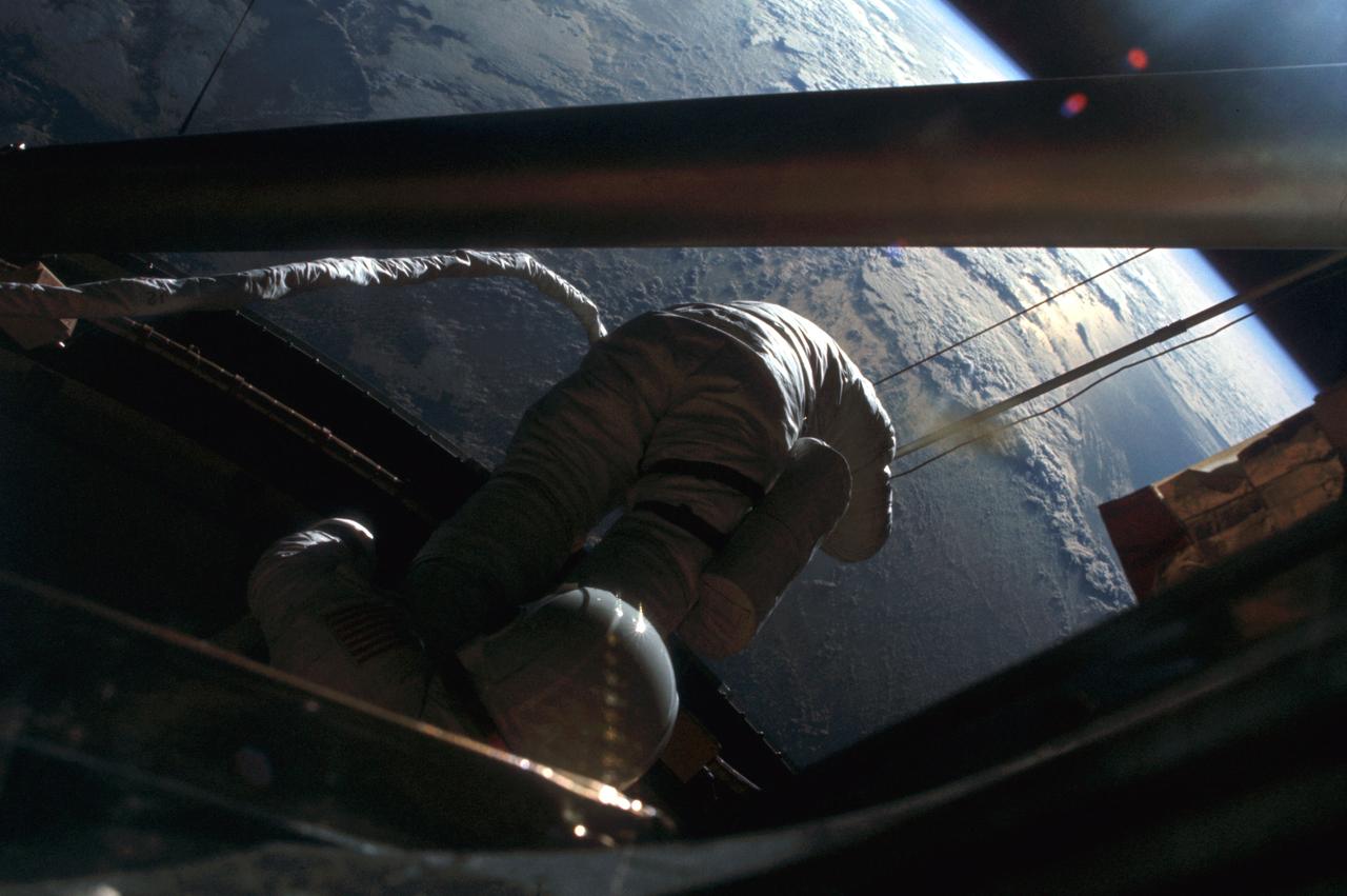 SL3-118-2182 (6 Aug. 1973) --- Skylab 3 astronaut participates in the Aug. 6, 1973 extravehicular activity (EVA) during which the twin pole solar shield was deployed to help shade the Orbital Workshop (OWS). Photo credit: NASA
