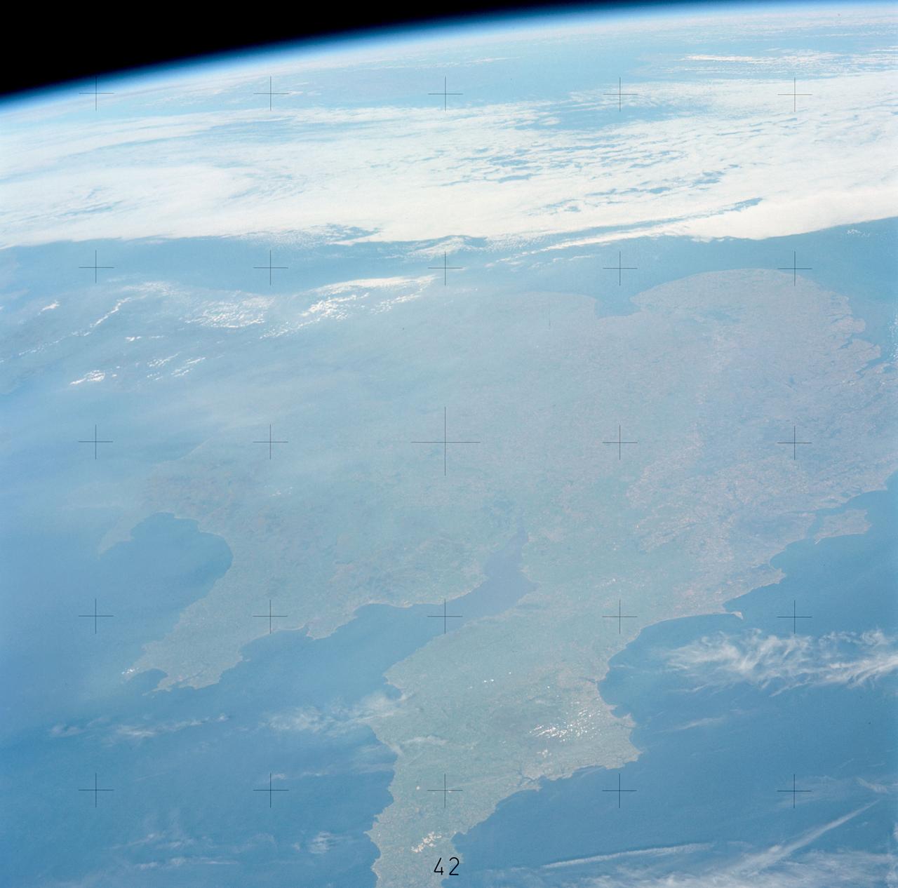 SL3-121-2445 (July-September 1973) --- An oblique view of a portion of Great Britain looking northeastward across England and Wales, as photographed by one of the Skylab 3 crewmen aboard the Skylab space station in Earth orbit. The picture was taken with a hand-held 70mm Hasselblad camera using a 100mm lens and SO-368 medium-speed Ektacrome film. The English Channel is at lower right. The Bristol Channel is at lower left. The North Sea with much cloud cover is in the background. Photo credit: NASA