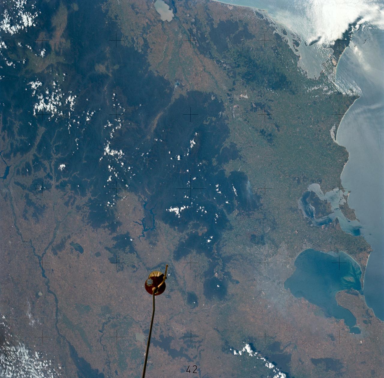 SL4-137-3579 (13 Dec. 1973) --- A near vertical view of the Melbourne, State of Victoria, Australia area as seen from the Skylab space station in Earth orbit. This picture was taken by one of the Skylab 4 crewmen using a hand-held 70mm Hasselblad camera. Included in this view are Port Phillip Bay, Ninety-Mile Beach and the Australian Alps. This view is not in sunglint. Compare this view with that of SL4-137-3578 which is in sunglint. Colors are not easy to distinguish in sunglint, but are without it. There are surface features visible in the first photograph which are not visible in the second. Similarly, some water colors are evident in the second photograph which are not seen in the first. Port Phillip Bay is the best sample. The bay opens to the south. Photo credit: NASA