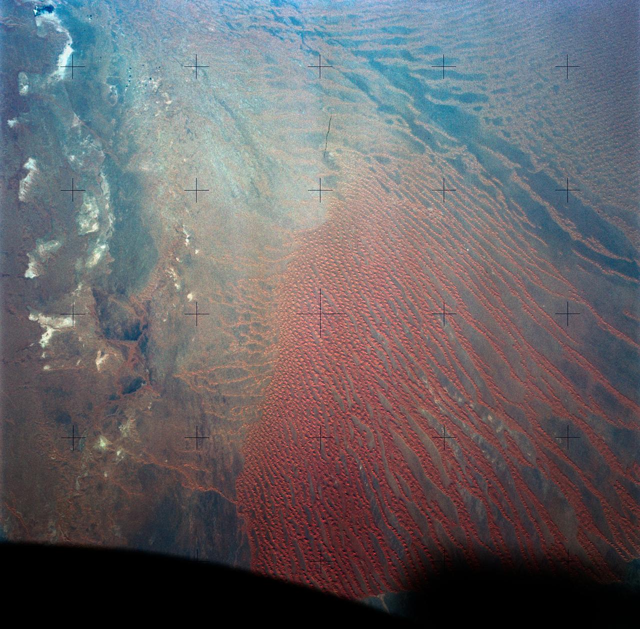 SL4-138-3820 (31 Dec. 1973) --- An north-looking oblique view of chains of star sand dunes in eastern Algeria as seen from the Skylab space station in Earth orbit. This picture was taken by one of the Skylab 4 crewmen with a hand-held 70mm Hasselblad camera. The low sun angle of about 25 degrees above horizontal enhances the detail in this picture. The coordinates of the center of the photograph are approximately 29.5 degrees north latitude and 5.0 degrees east longitude in the Grand Erg Oriental. The field of view at the base of the photograph is approximately 200 kilometers (125 miles). The individual dunes are roughly star-shaped rather than simple crescents which are common in dune fields. In this region the stars are aligned along ridges. The causes of these and a wide variety of other dune forms are little understood. Descriptions and photographs from Skylab 4 will be used by the U.S. Geological Survey in their world-wide study of dunes. Photo credit: NASA