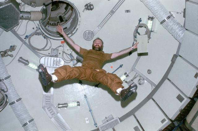 NASA image: Astronaut Gerald Carr floats in forward dome area