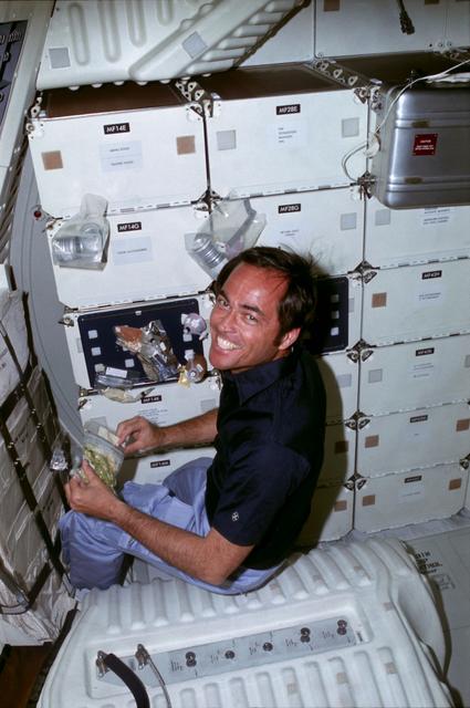 NASA image: Pilot Crippen prepares meal on middeck